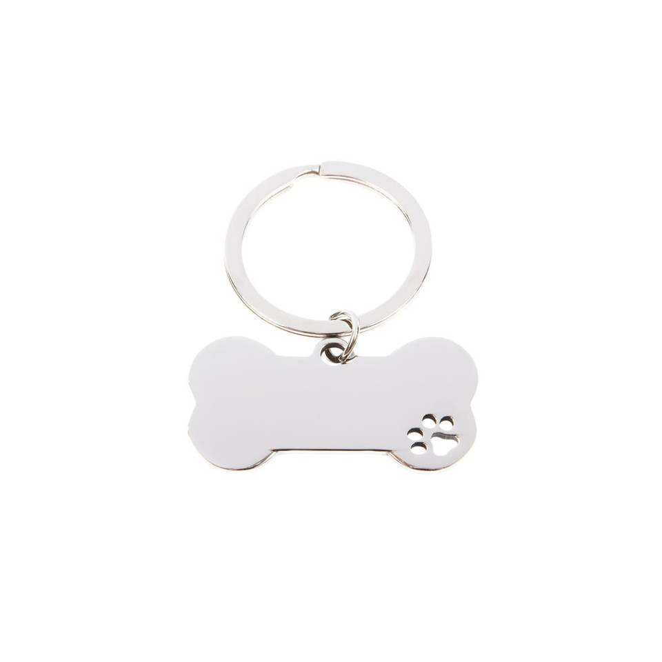 A silver keytag in the shape of a dog bone with a paw print design. It features a split ring for attachment.