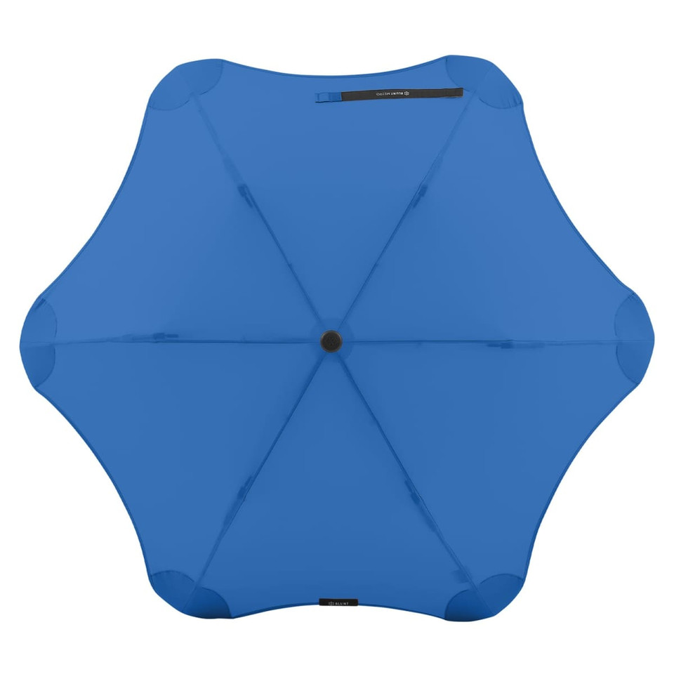 A blue BLUNT Metro Umbrella with a unique octagonal shape and a central black button, featuring branding.