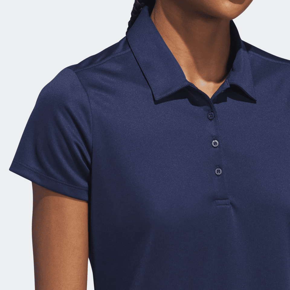 A navy blue women's polo shirt with a buttoned placket and a collar, featuring short sleeves.