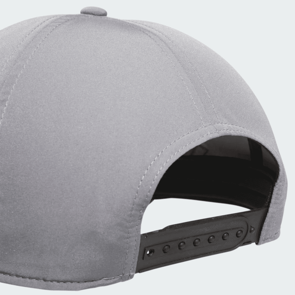 A grey Adidas performance golf cap featuring a black adjustable strap at the back and a branded logo.