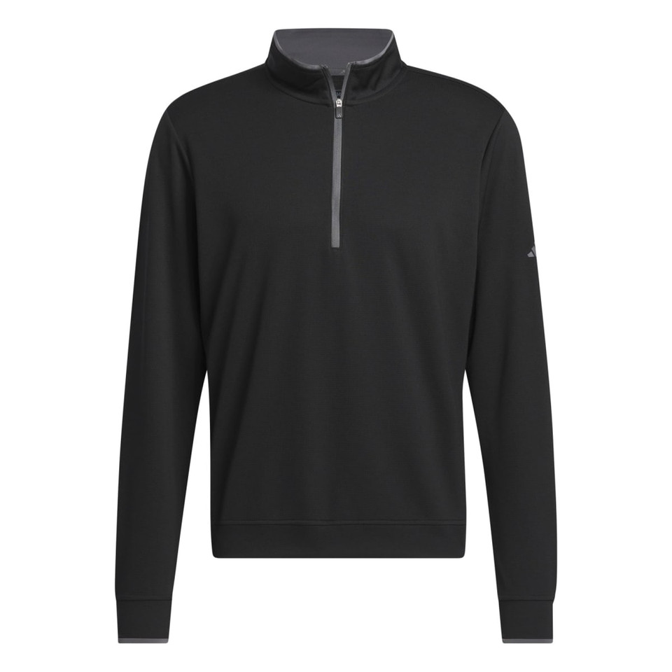 A black quarter zip pullover for men, featuring a light grey zip and a logo on the sleeve.