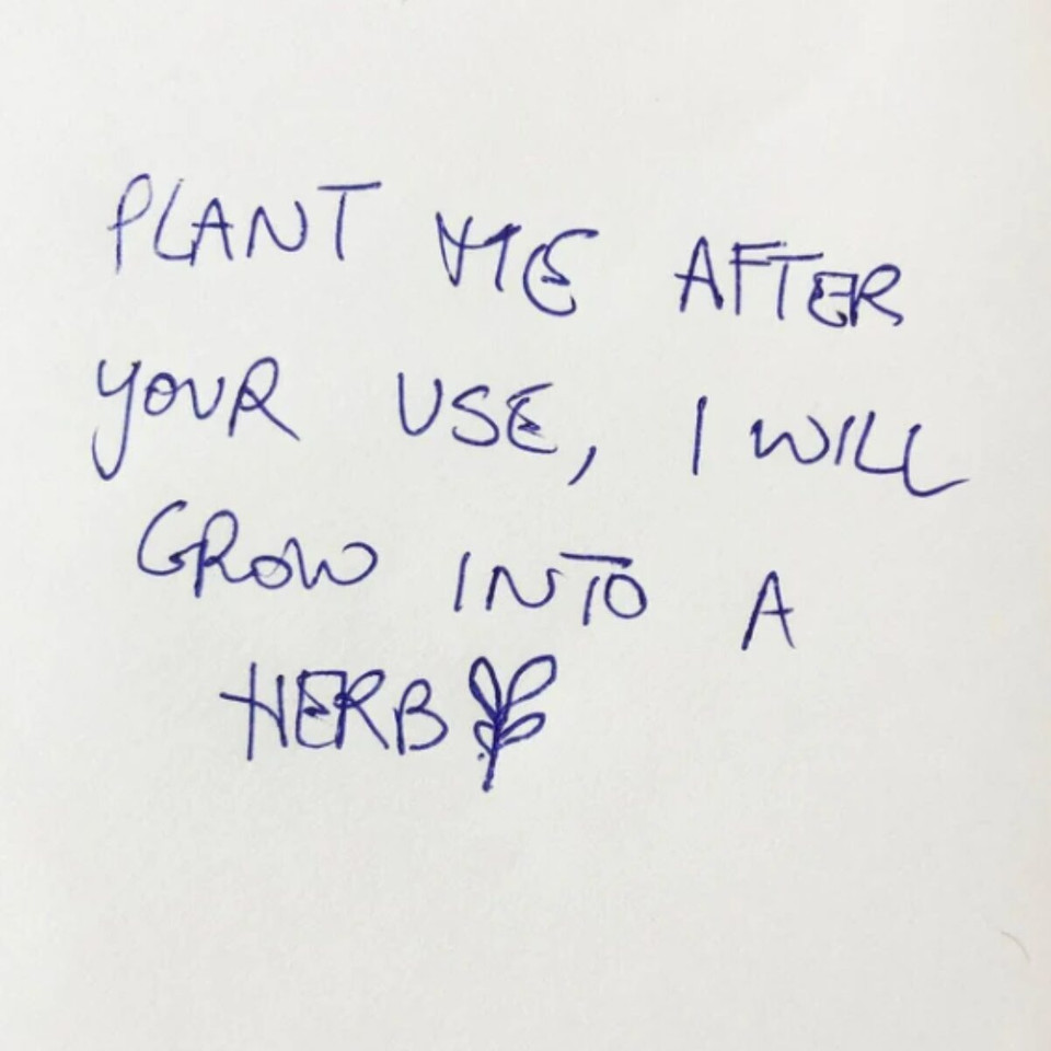 Handwritten note saying "Plant me after your use, I will grow into a herb" with a small herb drawing.
