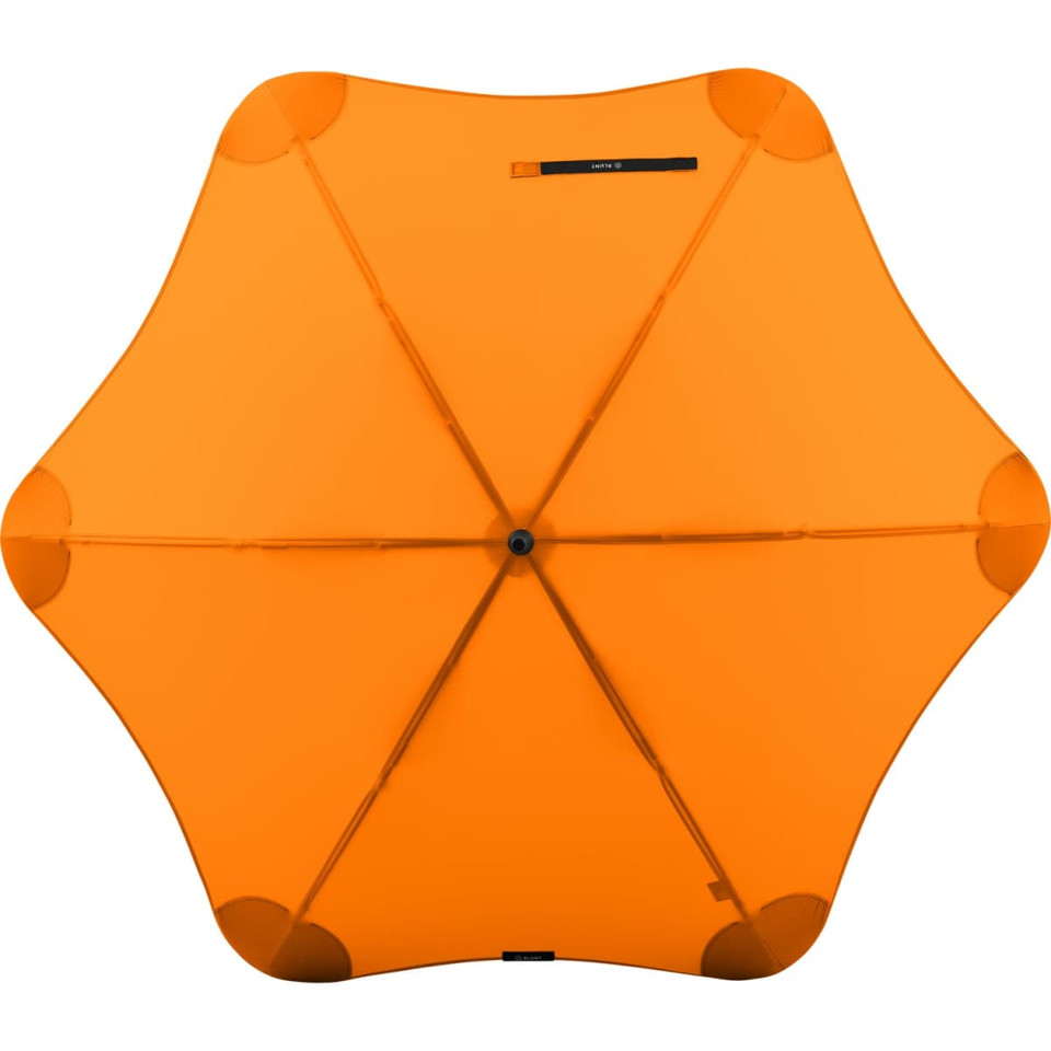 An orange BLUNT Classic Umbrella featuring a star-shaped canopy and a central hub, with a logo present.