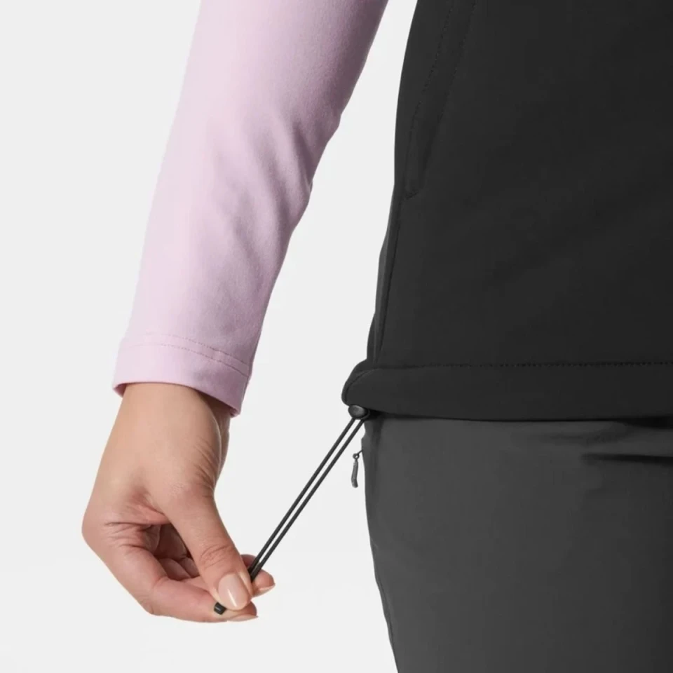 Detail image of the black softshell vest featuring an adjustable drawcord hem for a customizable and secure fit.