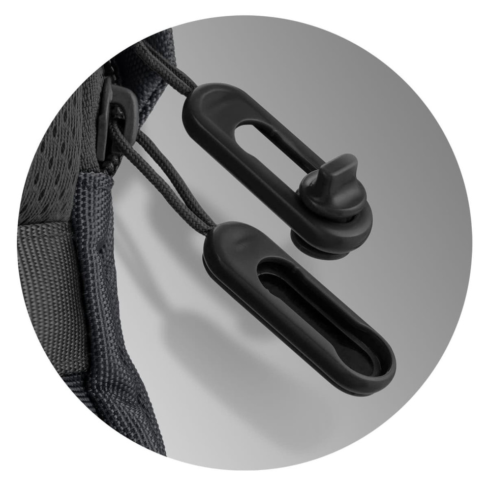A close-up view of a black toggle and cord on a backpack, featuring sleek, functional design elements.