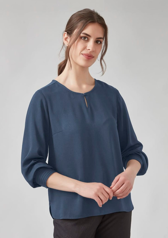 A women’s long sleeve blouse in navy blue with a round neckline and keyhole detail. Features a relaxed fit.