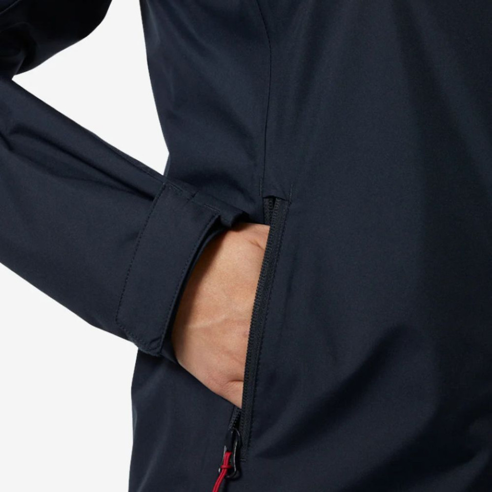 Person's hand in a black jacket pocket with zipper detail.