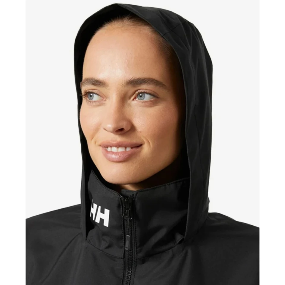 Close-up view of the Crew Women's Hooded Jacket 2.0 with the hood raised, featuring a high protective collar, full-zip closure, and HH logo detailing.