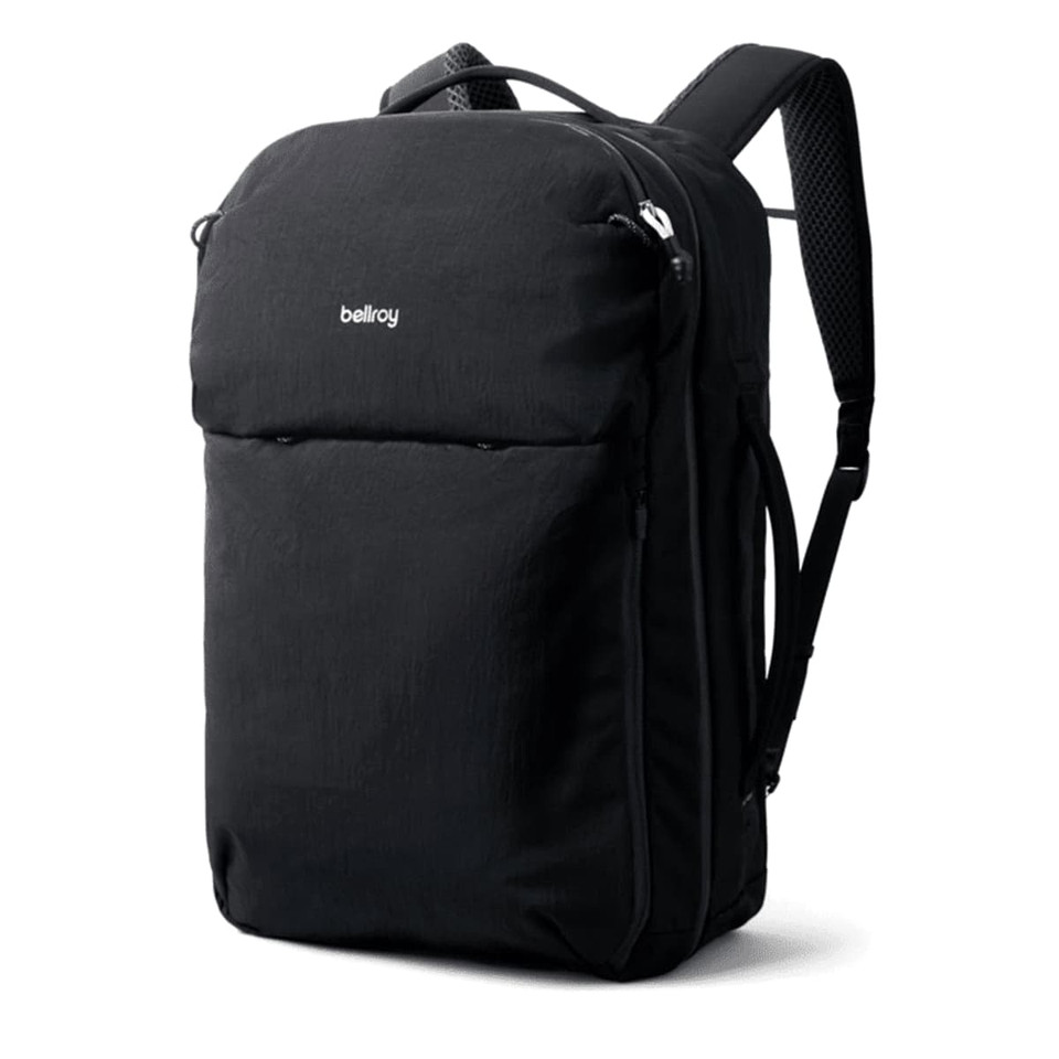 A black backpack with multiple compartments and padded shoulder straps, featuring a logo on the front.