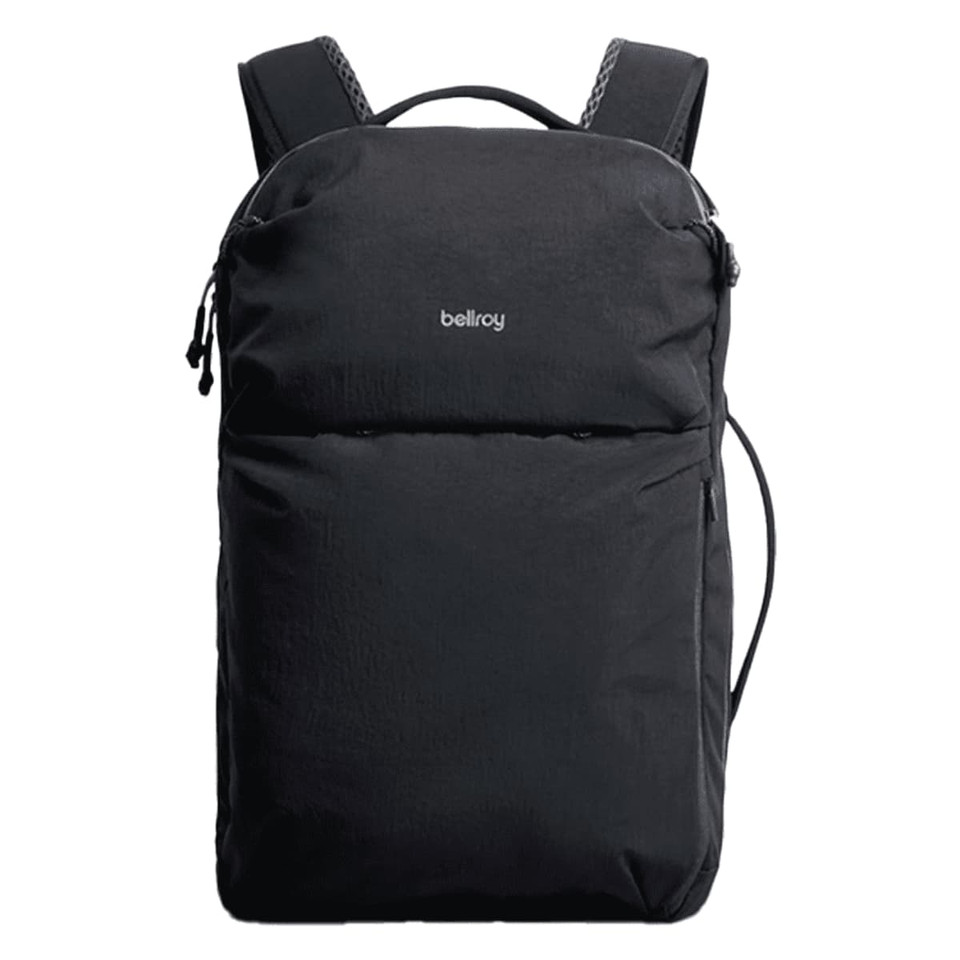 A black backpack with shoulder straps, featuring a front pocket and a logo on the exterior.