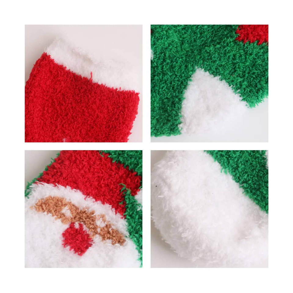 A set of coral fleece socks featuring a festive design in red, green, and white, with a fluffy texture.