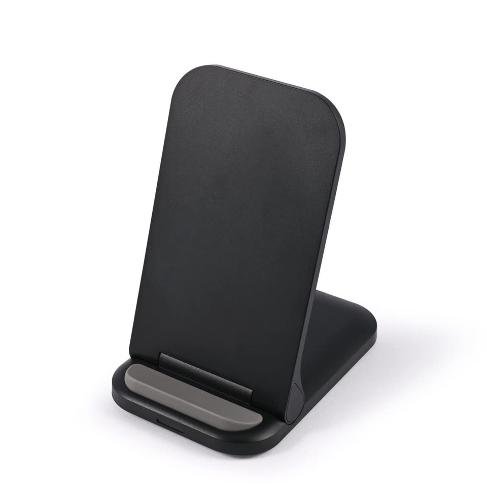 A black wireless charger with a sleek, angled design and a small base for stability.
