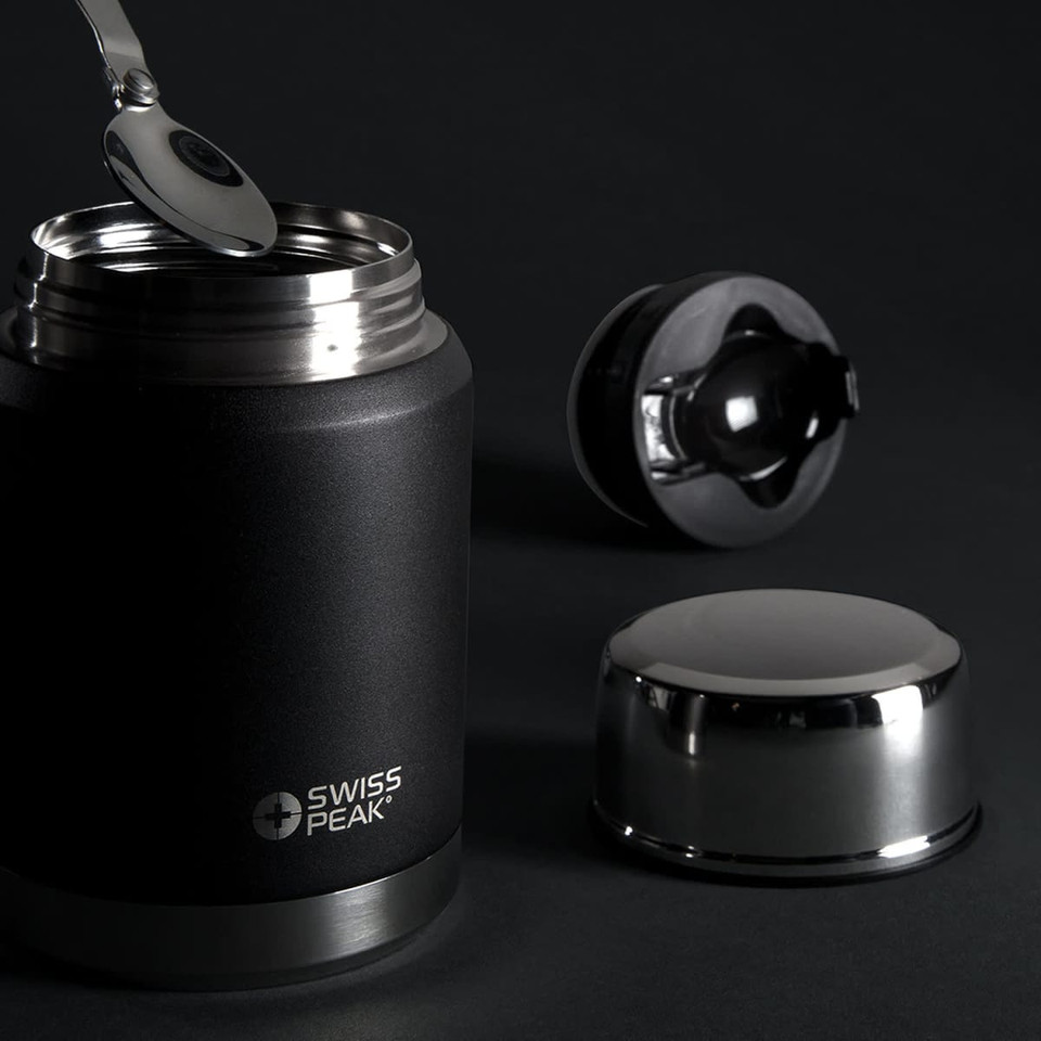 A drink bottle in matte black with a metallic silver lid and spoon, featuring a logo.