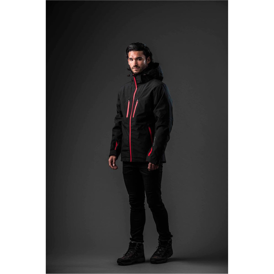 A black jacket with red accents, featuring a hood and a logo, displayed on a model against a dark background.