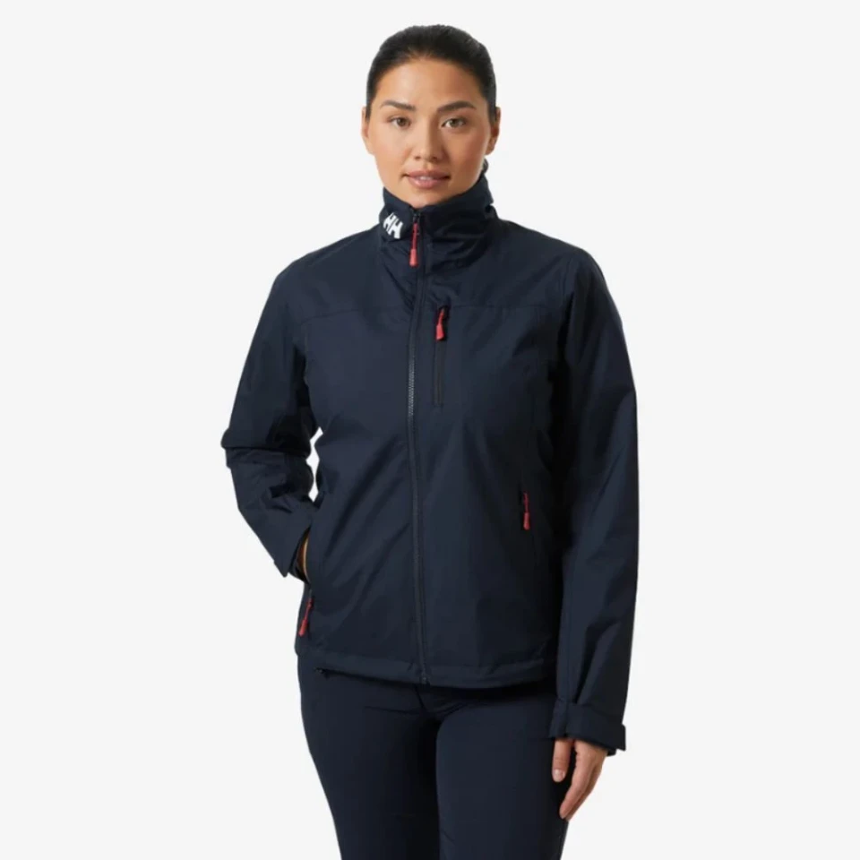 Navy Crew Women's Midlayer Jacket 2.0 with a stand-up collar, full zip, and zippered pockets.