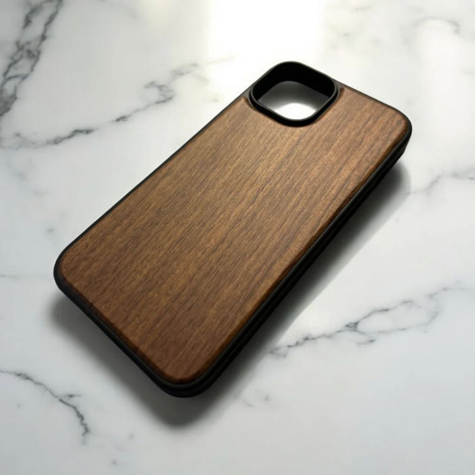 Wooden phone case on marble surface.