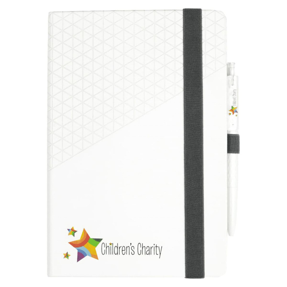 A white notebook with a geometric design and a grey elastic band, accompanied by a white pen.