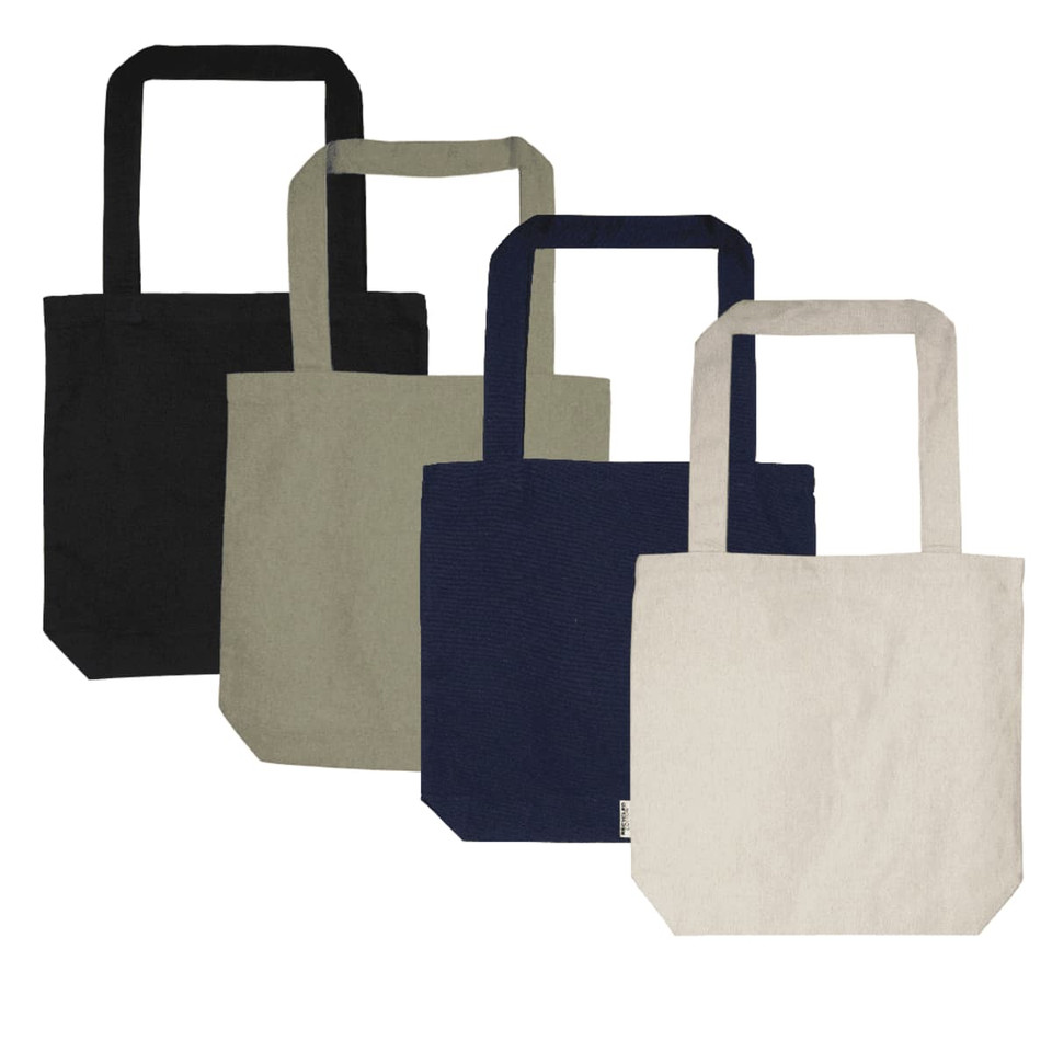 A collection of four tote bags in black, olive green, navy blue, and beige, each with sturdy handles and a logo.