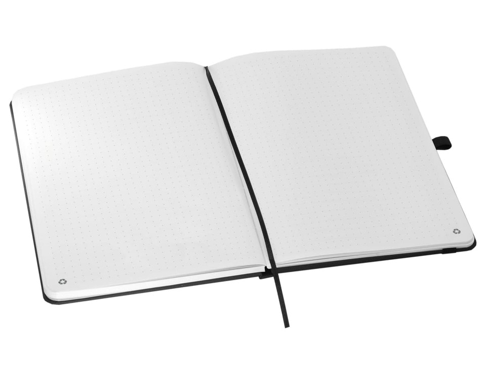 An A5 notebook with a black cover and dot grid pages, featuring a ribbon bookmark and an elastic closure.