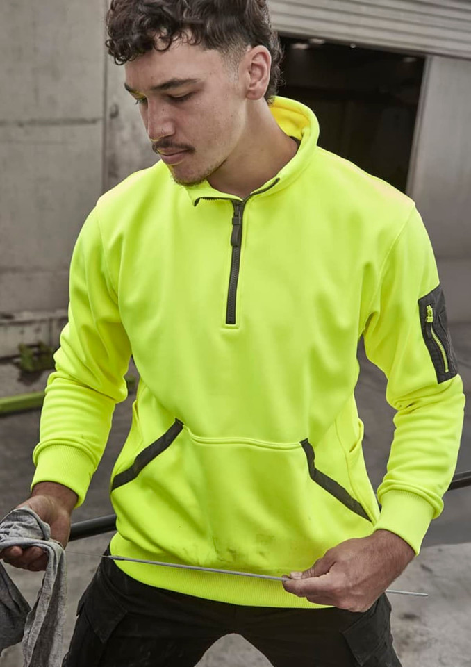 A bright yellow unisex water-resistant 1/4 zip pullover with a front pocket and branding.