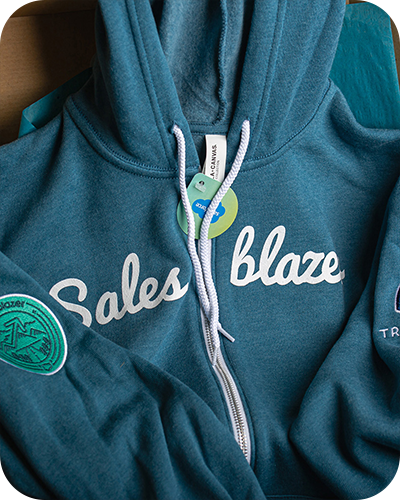 A close-up image of blue Salesforce branded zip-up hoodie
