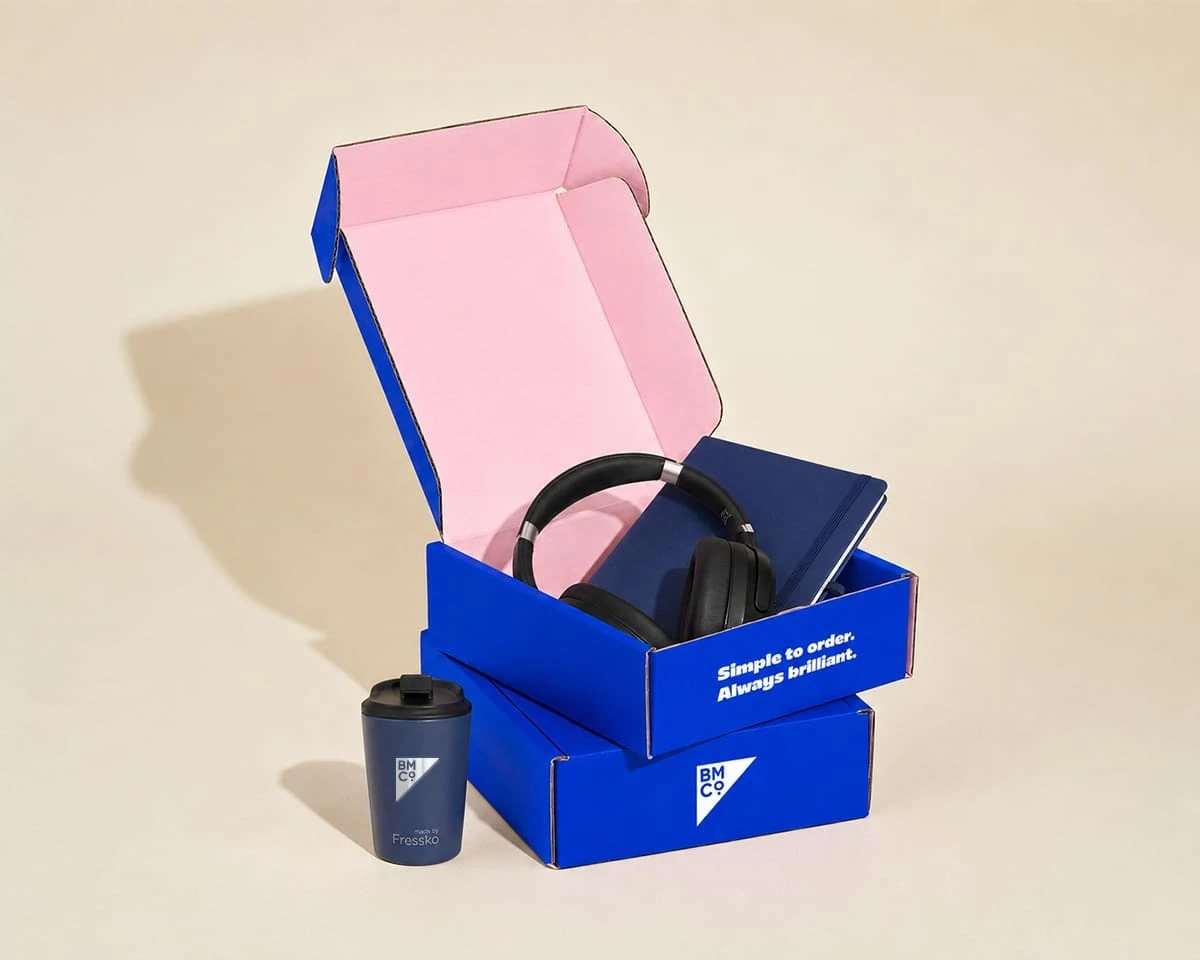 A welcome pack containing a notebook, headphones and tumbler