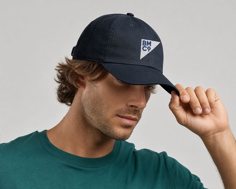 A man wearing a Fraser organic dad hat with an embroidered Brilliant Merch Co logo