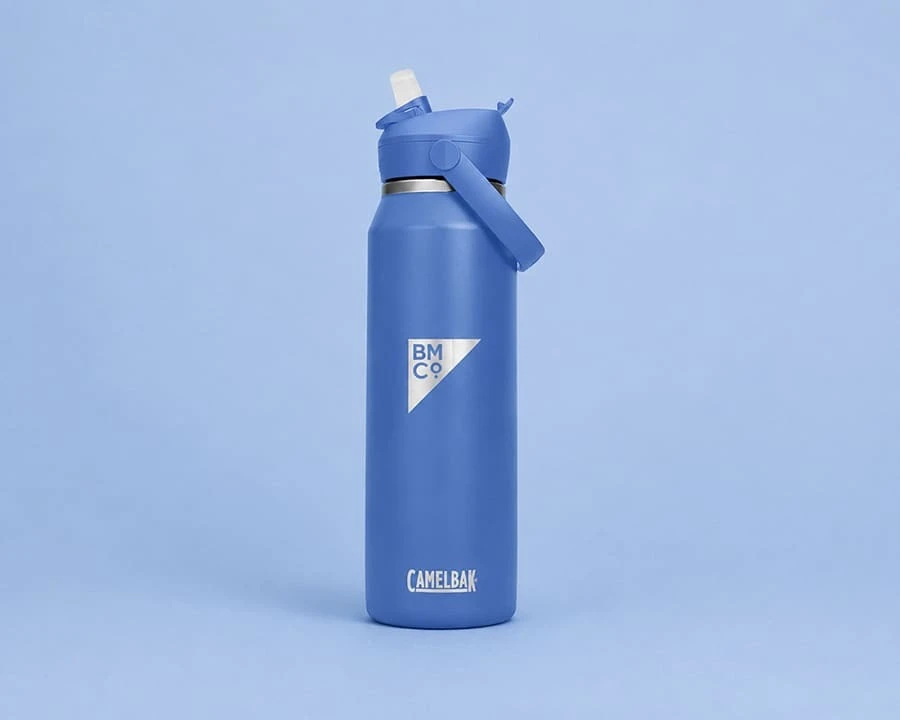 A blue Camelbak flip straw insulated steel bottle with laser engraved logo