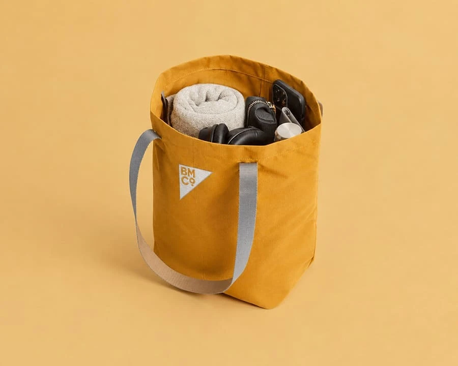 A copper Bellroy city tote bag with embroidered logo