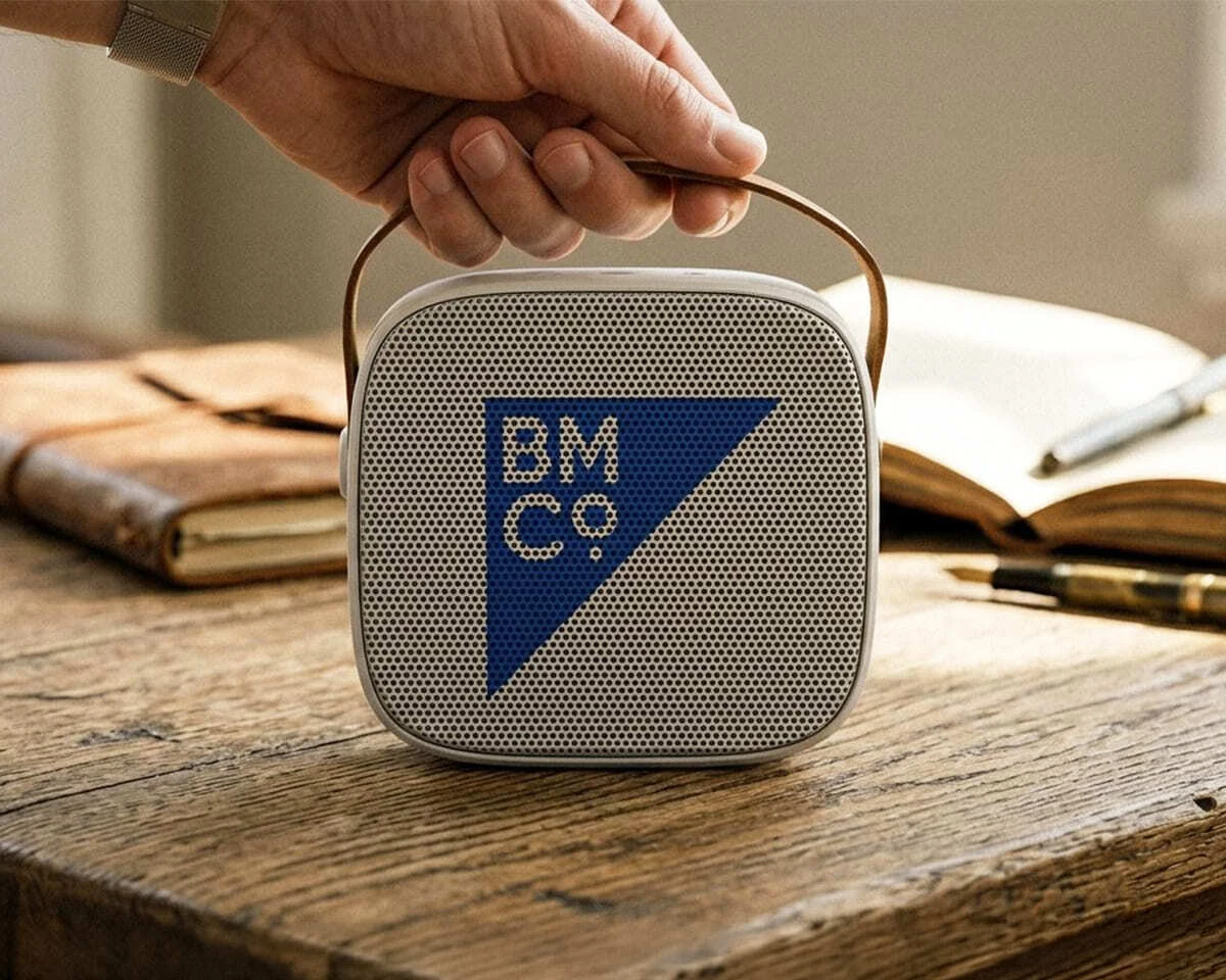 A boombox mini speaker on a woodedn table