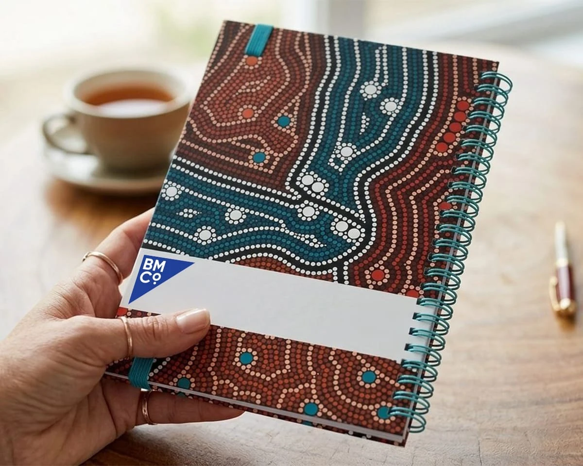 An A5 wira notebook with an indigenous design
