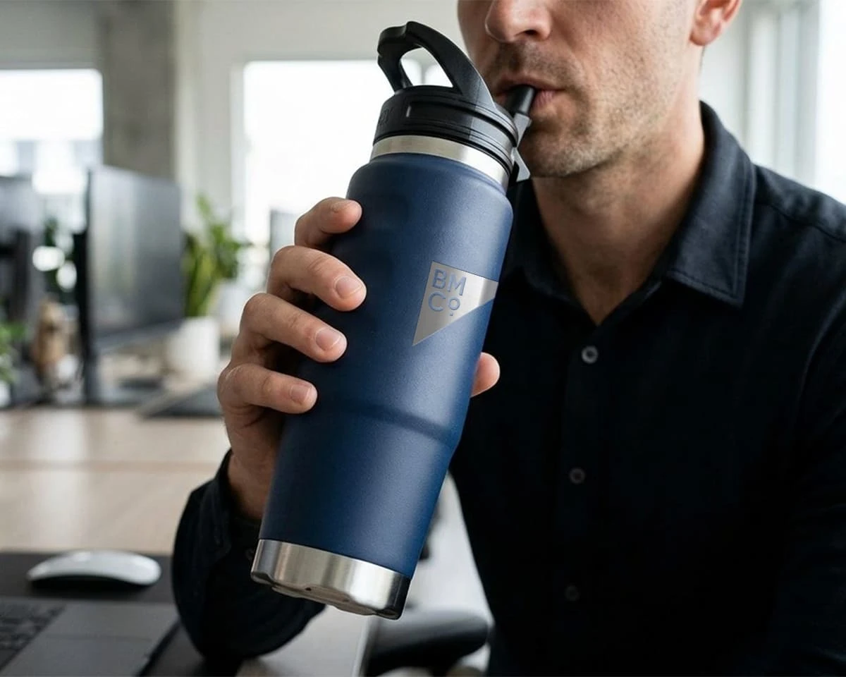 A man drinking out of a Fridgy cruise bottle