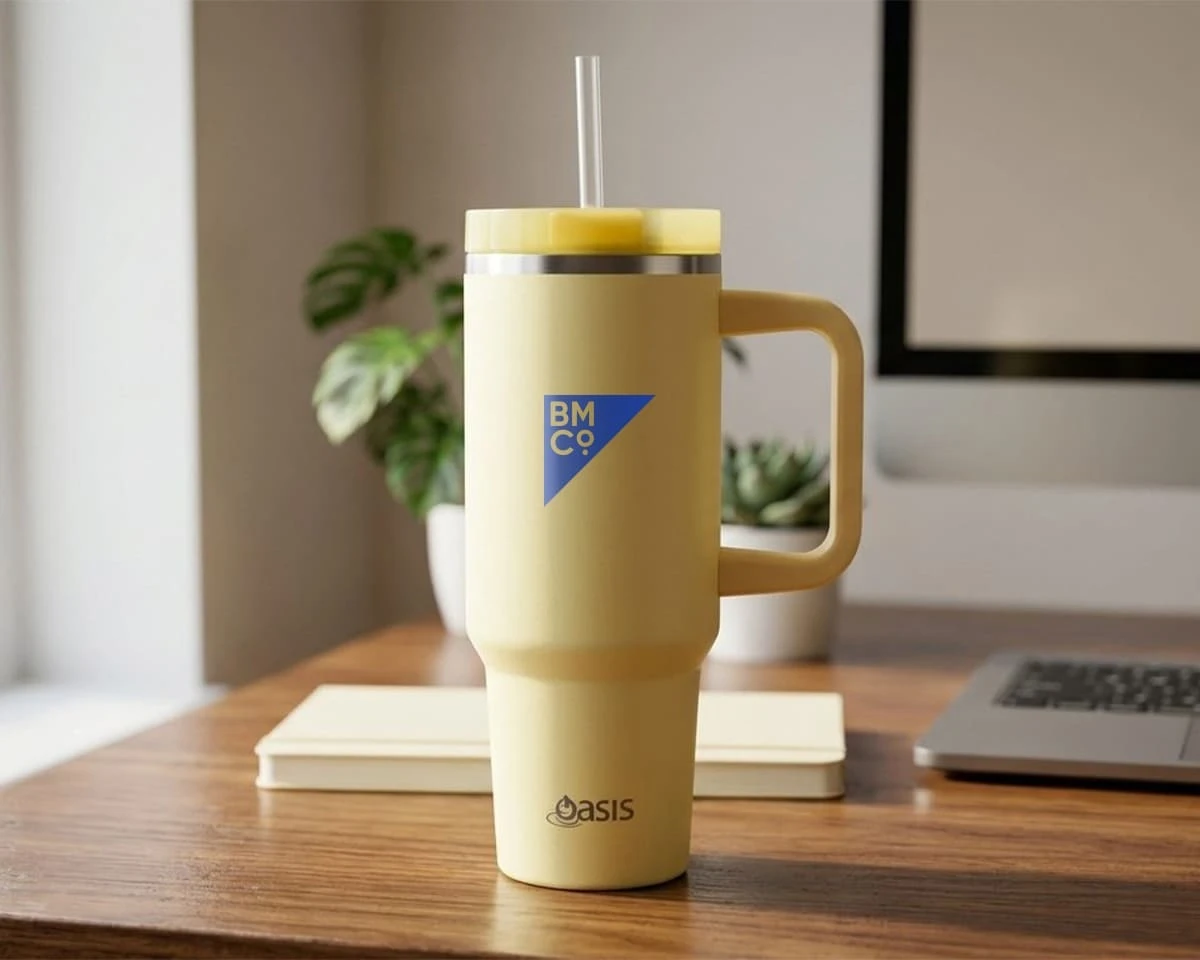 A yellow Oasis commuter 1.2L vacuum travel tumbler