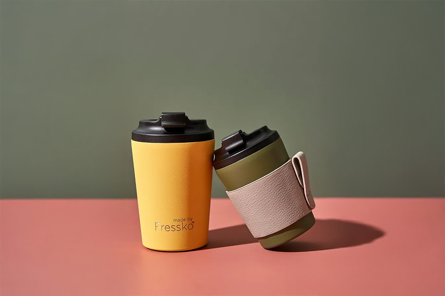 A yellow and green fressko cup