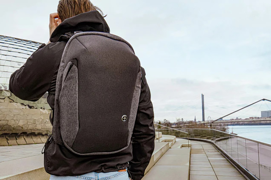 A man carrying a swissdigital backpack