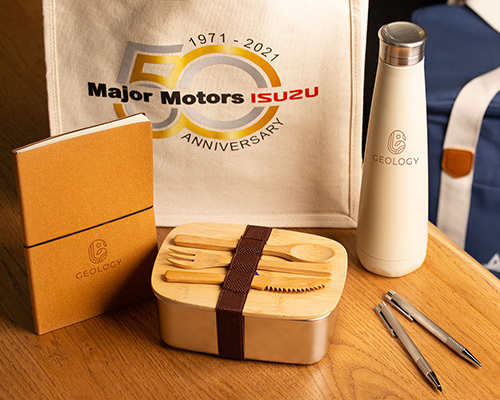 An eco-friendly gift set featuring a geology branded merchandise and a bag commemorating major motors isuzu's 50th anniversary