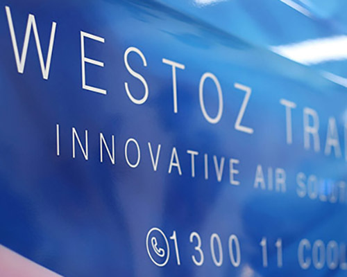 Close-up of a blue truck with white text