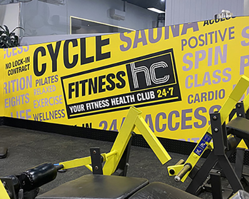 Bright gym interior with bold yellow wall