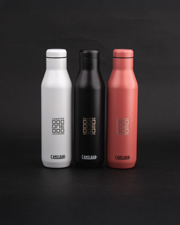 Three coloured bottles standing in a row
