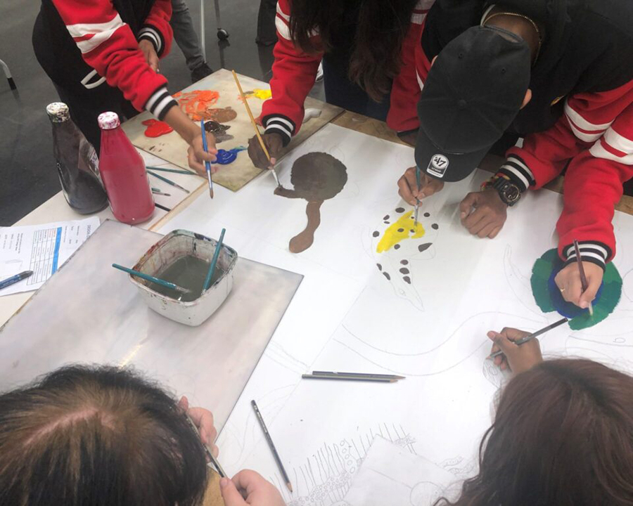 Group of students working together on artwork