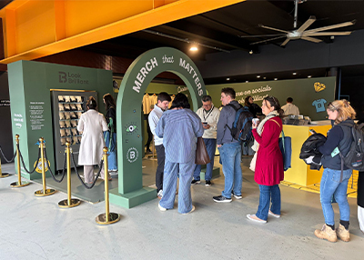 Line of people chatting and waiting to try the look brilliant vending machine