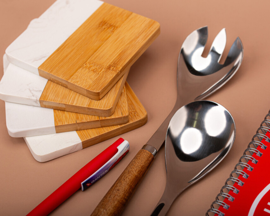 A collection of kitchenware items and stationery