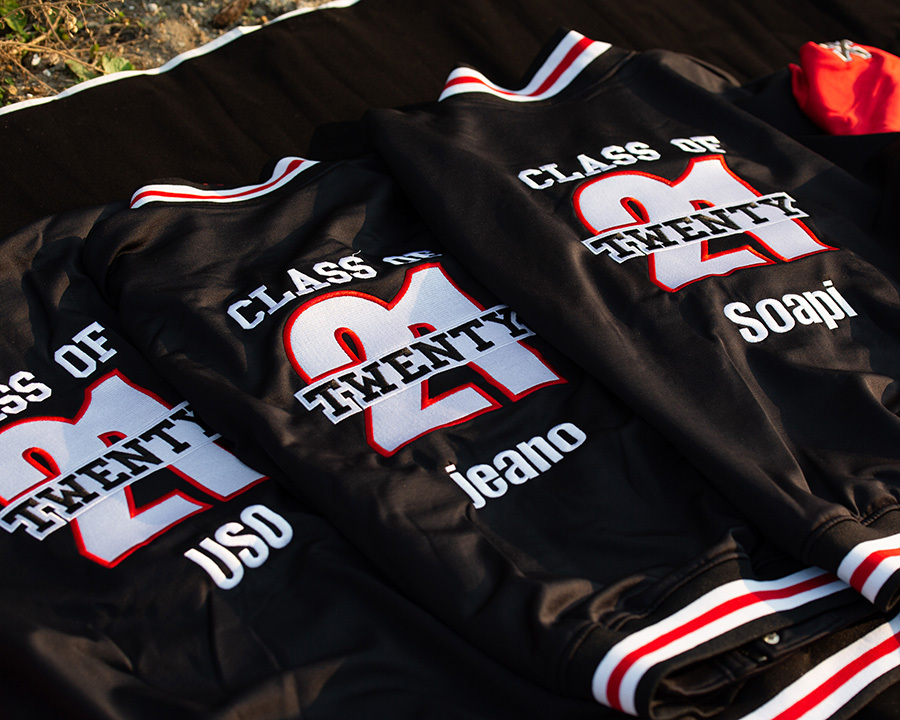 Close-up of the back of three leavers jackets