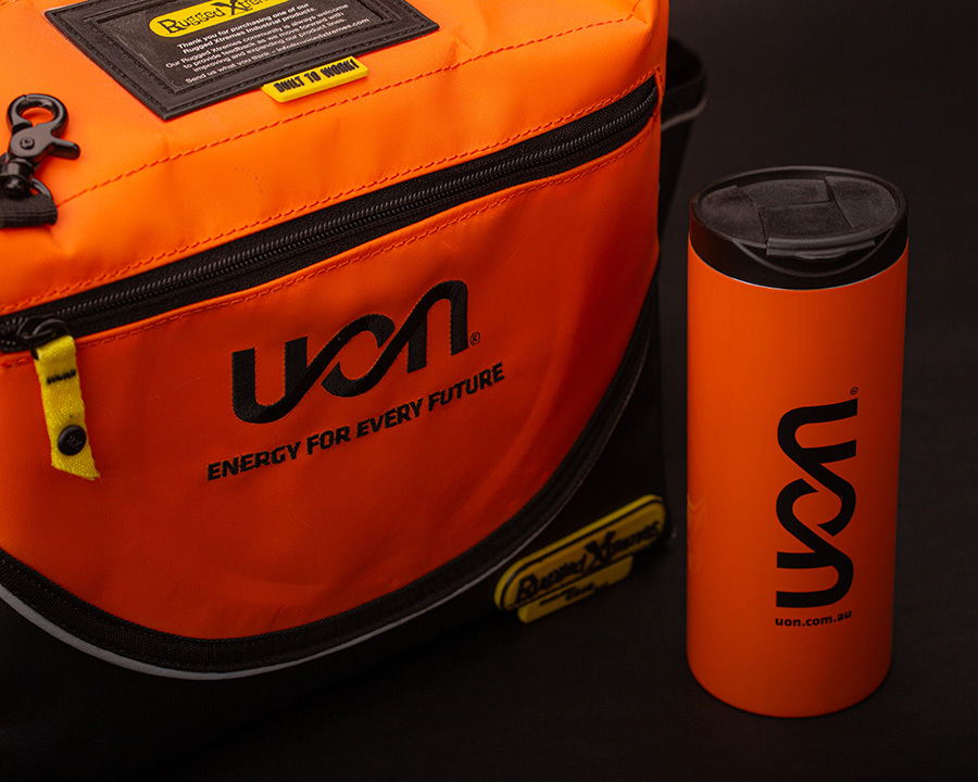 An orange uon branded bag and bottle