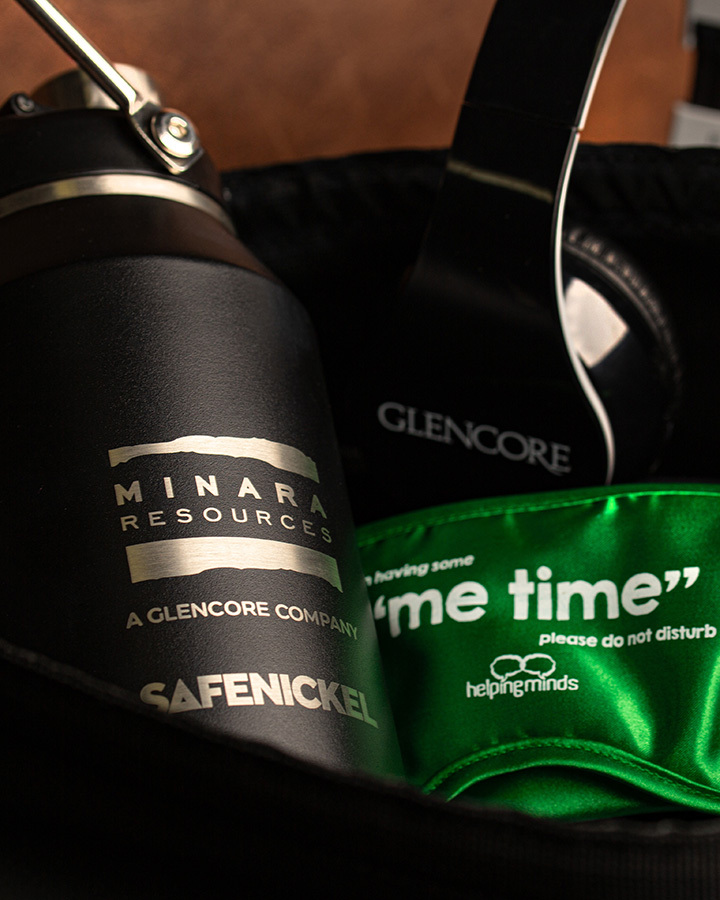 A close-up shot of minara resources branded bottle and eye-mask