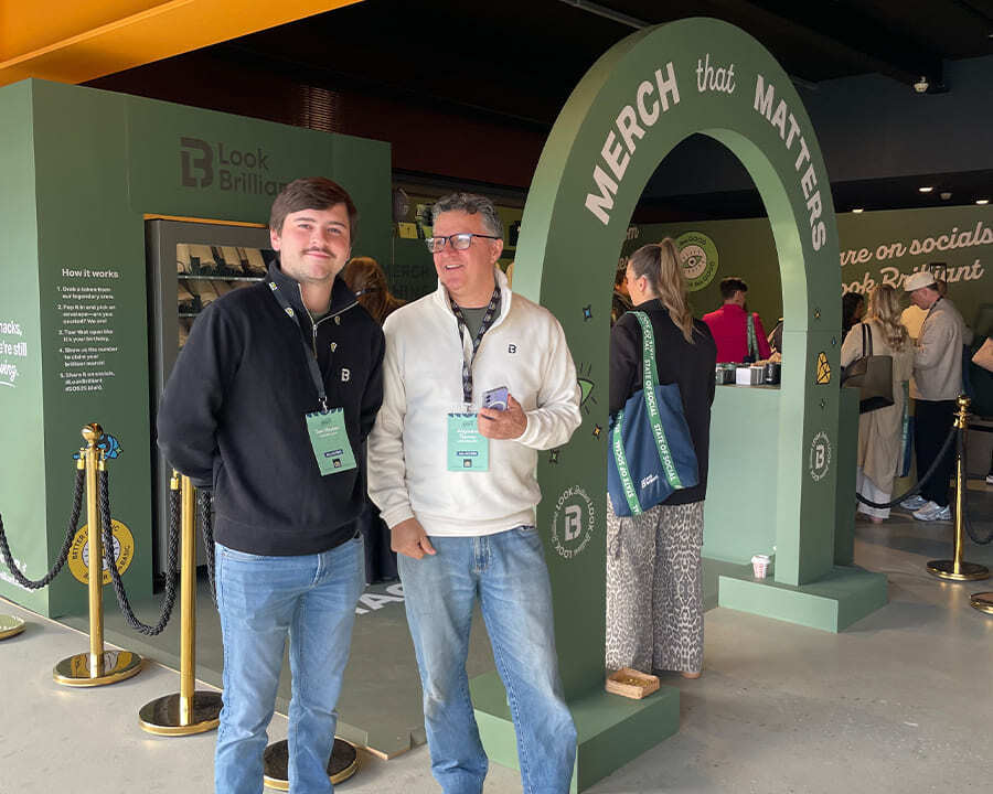 Two Look Brilliant employees standing next to State of Social activation