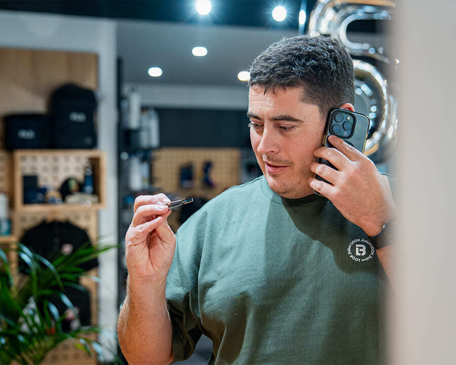 Look Brilliant employee inspecting custom badge