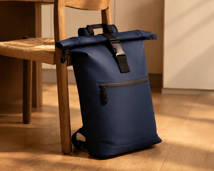 A navy blue resi recycled roll top backpack