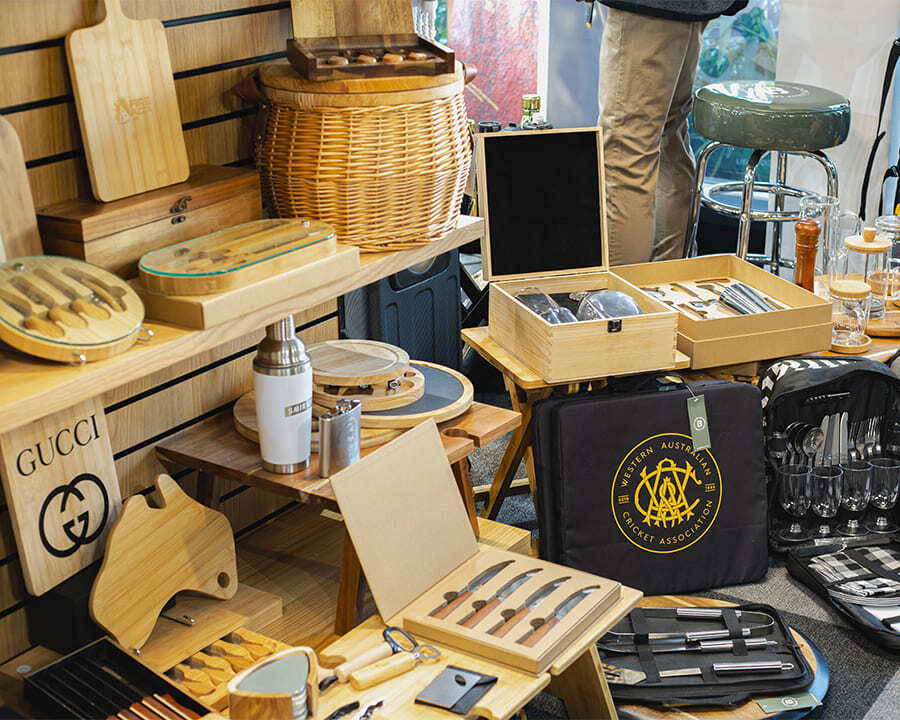 A collection of wooden and sustainable branded merch items