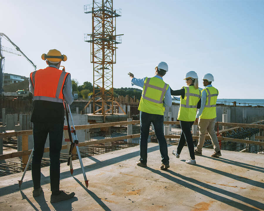 Group of people surveying a construction site